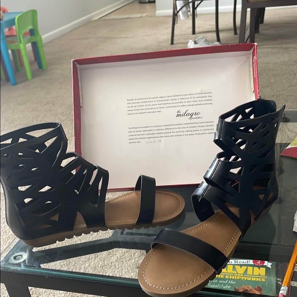 Black Sandals with Intricate Cut-Out Design and Ankle Strap